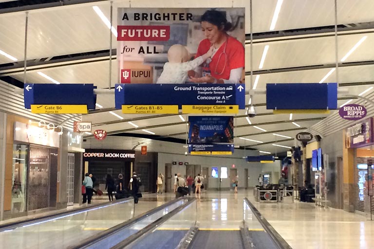 IUPUI signage hanging in Indianapolis airport terminal